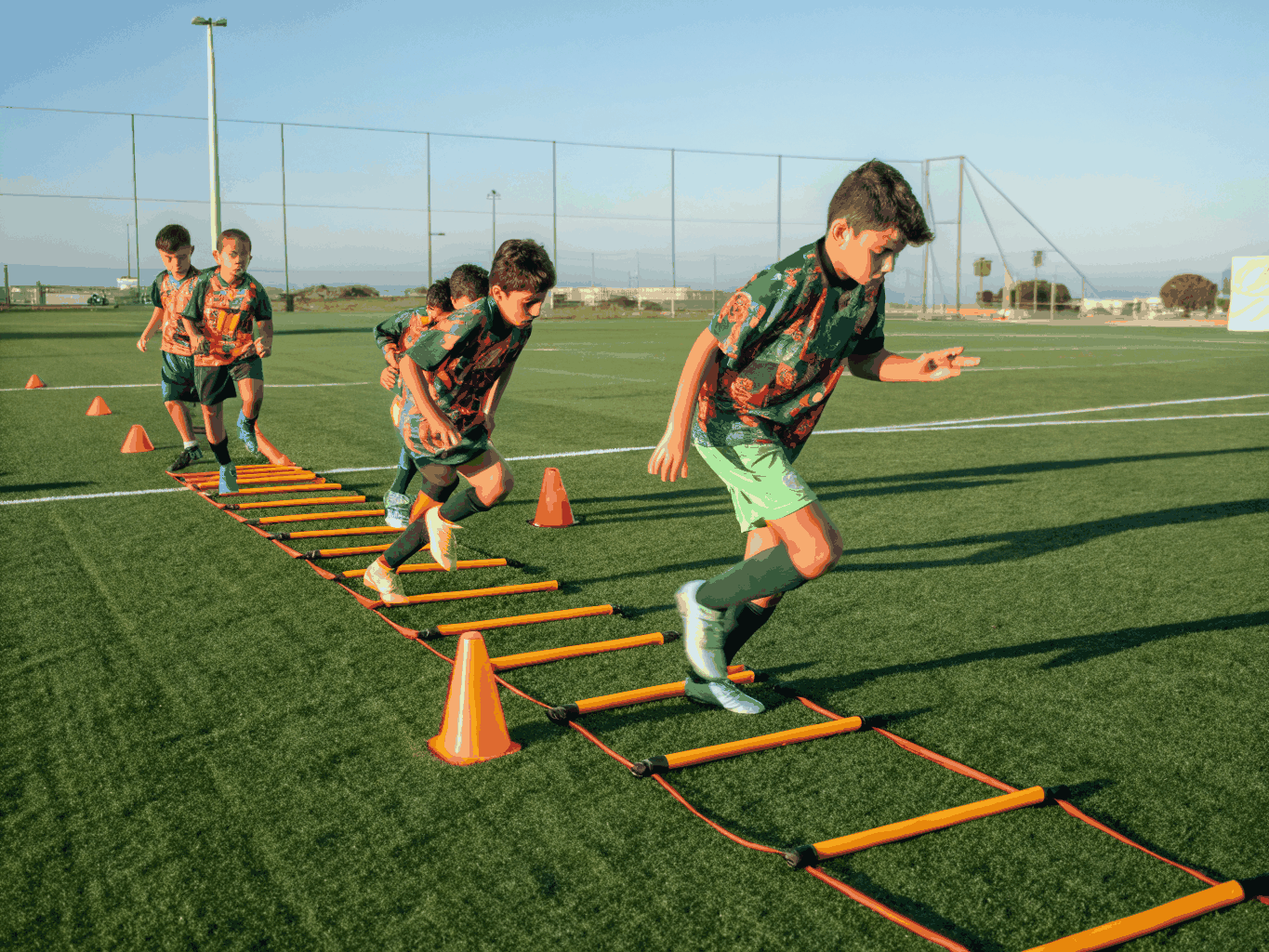 Athletic agility ladder drills during weekend morning camp